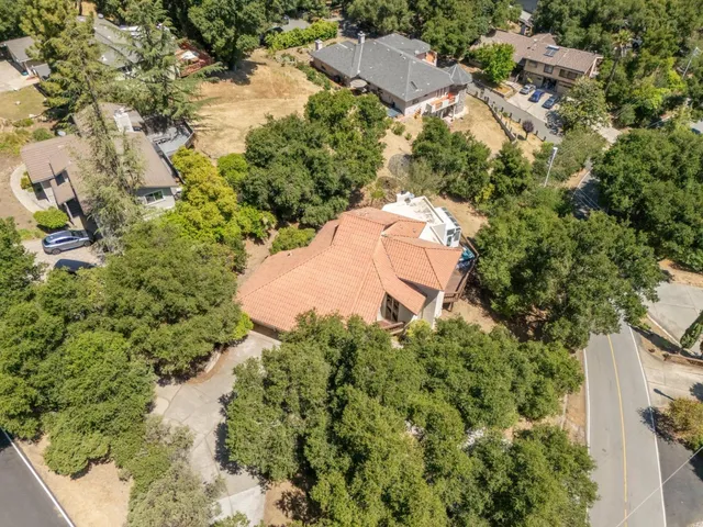 an aerial view of a house with mountain view