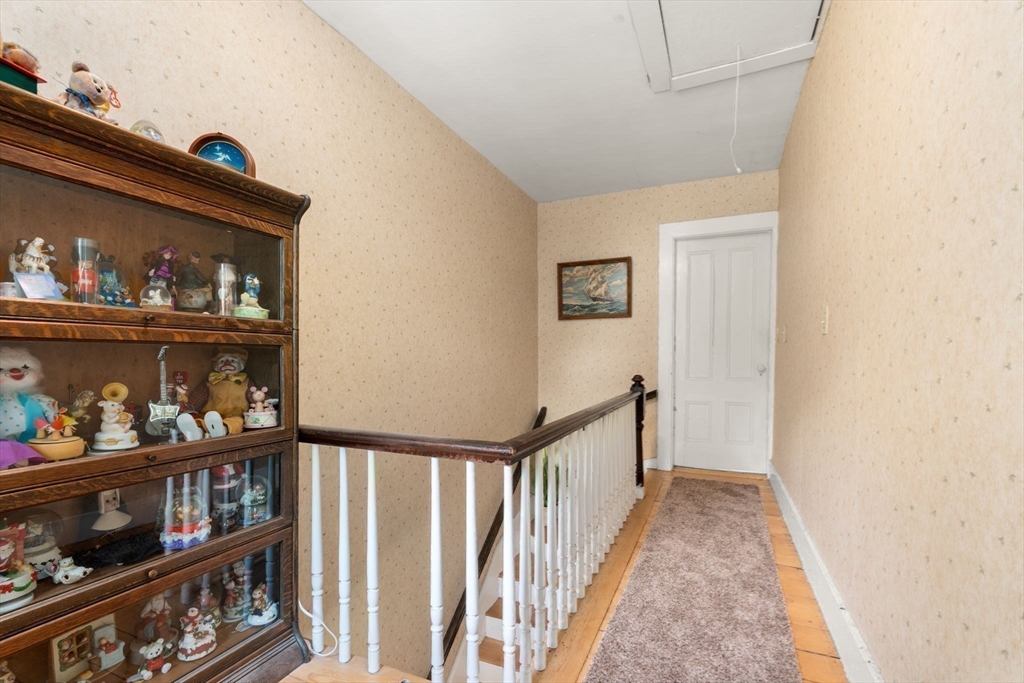130 Tower Road Lincoln, MA 01773 - Photo 13 of 21 a view of a hallway to room with wooden floor