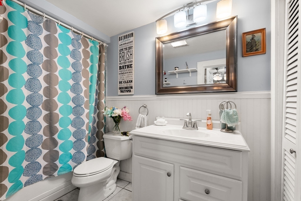 130 Tower Road Lincoln, MA 01773 - Photo 17 of 21 a bathroom with a sink mirror and toilet