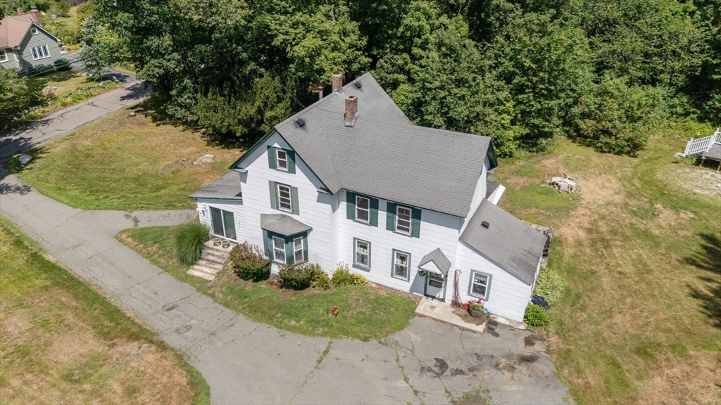 130 Tower Road Lincoln, MA 01773 - Photo 19 of 21 an aerial view of a house with a yard and garage