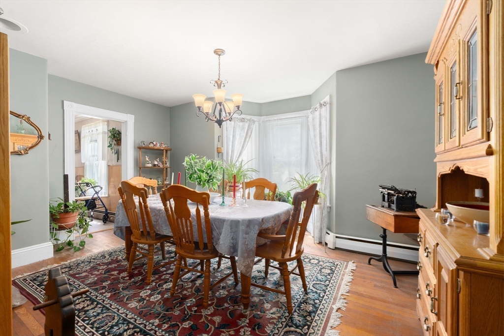 130 Tower Road Lincoln, MA 01773 - Photo 2 of 21 a view of a dining room with furniture window and wooden floor