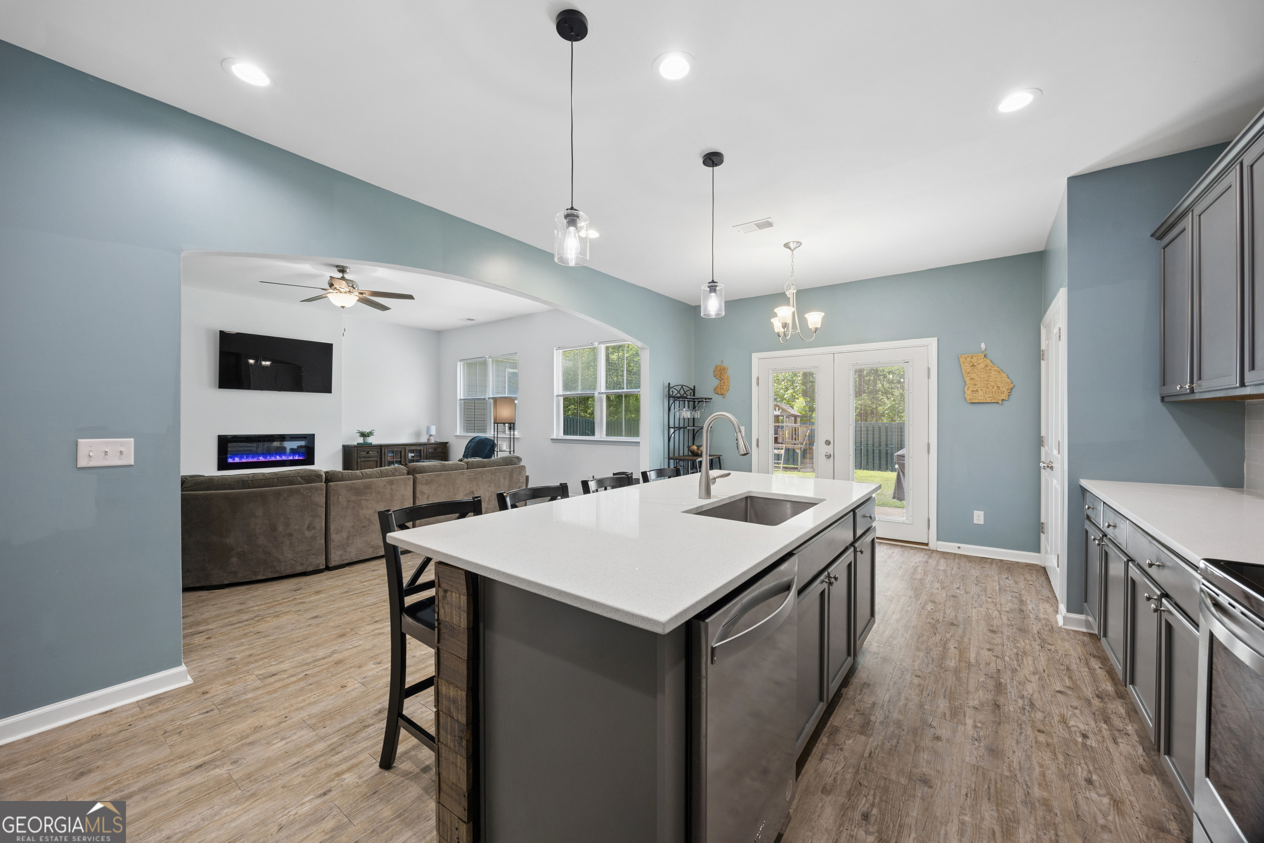 369 Waybridge Way Richmond Hill, GA 31324 - Photo 19 of 40 an open kitchen with a sink and refrigerator