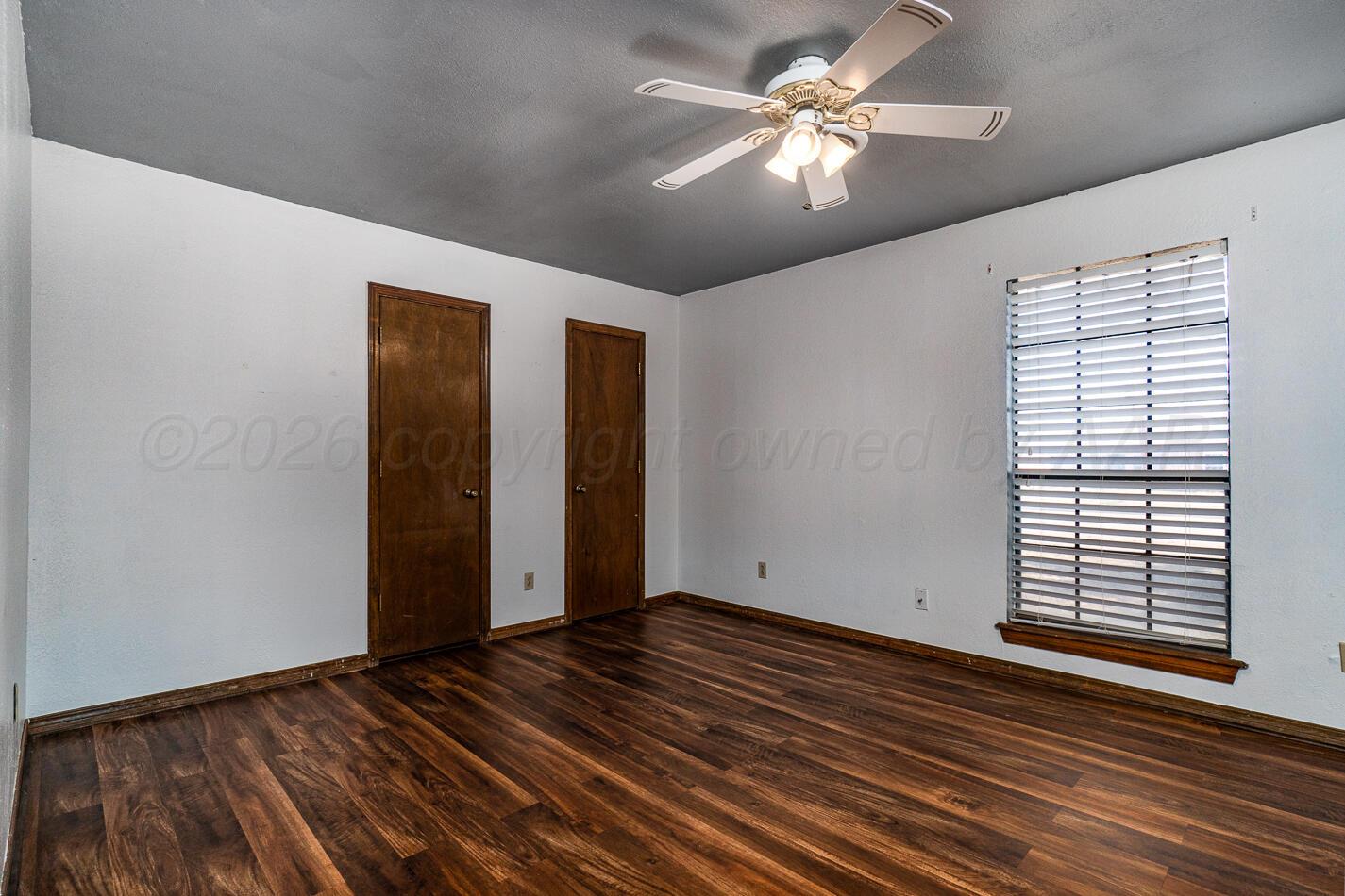 7803 Farrell Drive Amarillo, TX 79121 - Photo 17 of 29 a view of room with window and ceiling fan
