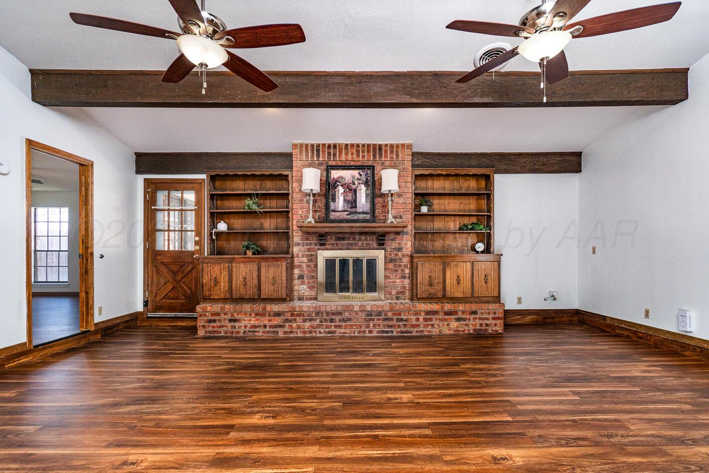 7803 Farrell Drive Amarillo, TX 79121 - Photo 2 of 29 a view of a livingroom with wooden floor