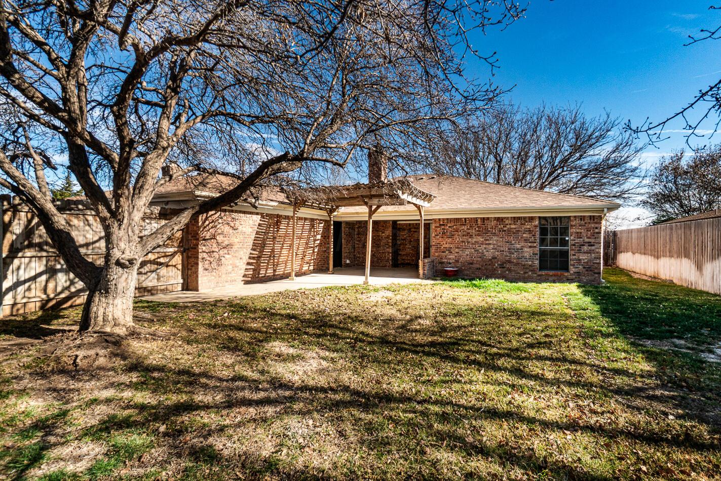 7803 Farrell Drive Amarillo, TX 79121 - Photo 26 of 29 a front view of a house with a garden