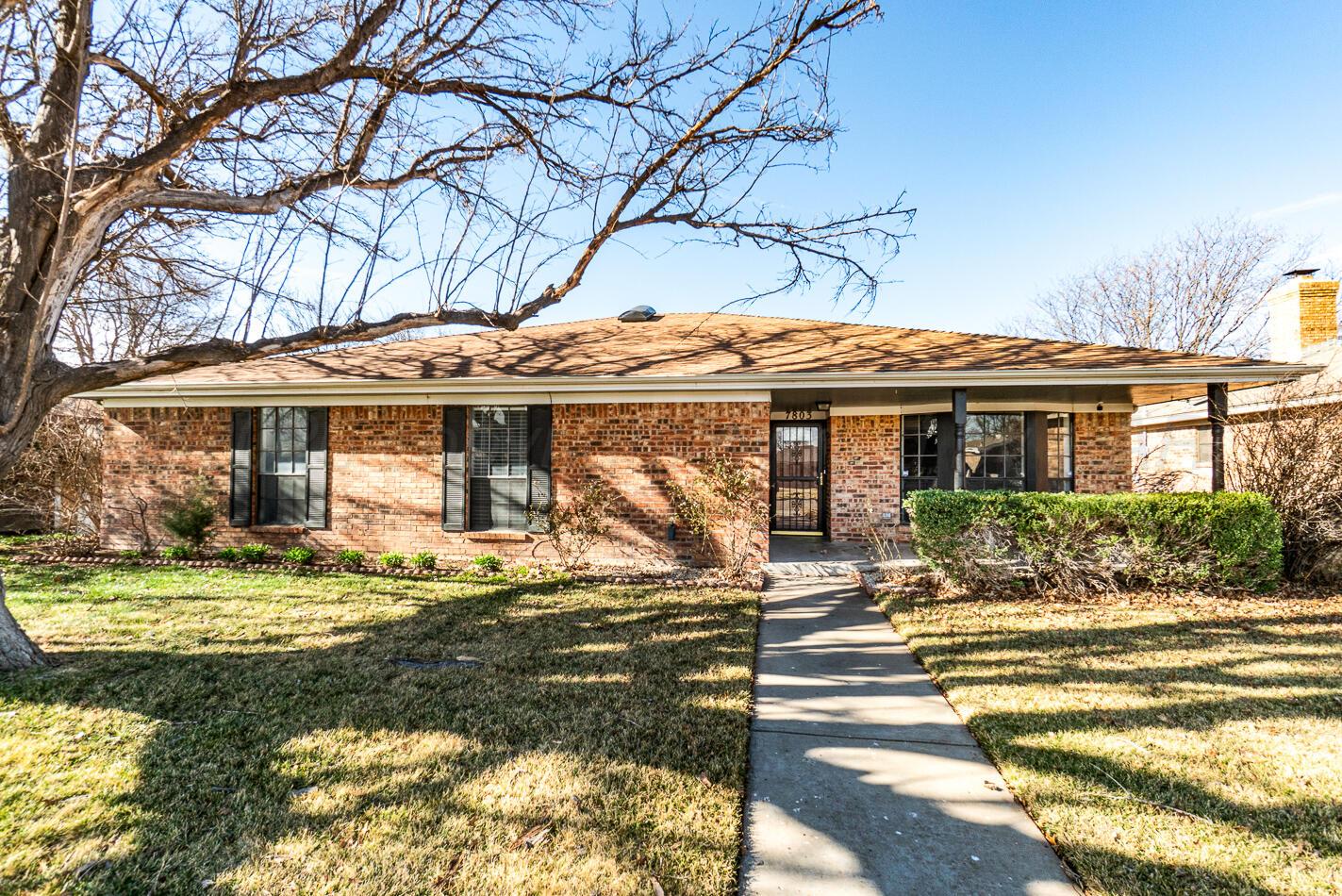7803 Farrell Drive Amarillo, TX 79121 - Photo 27 of 29 a front view of a house with a yard table and chairs