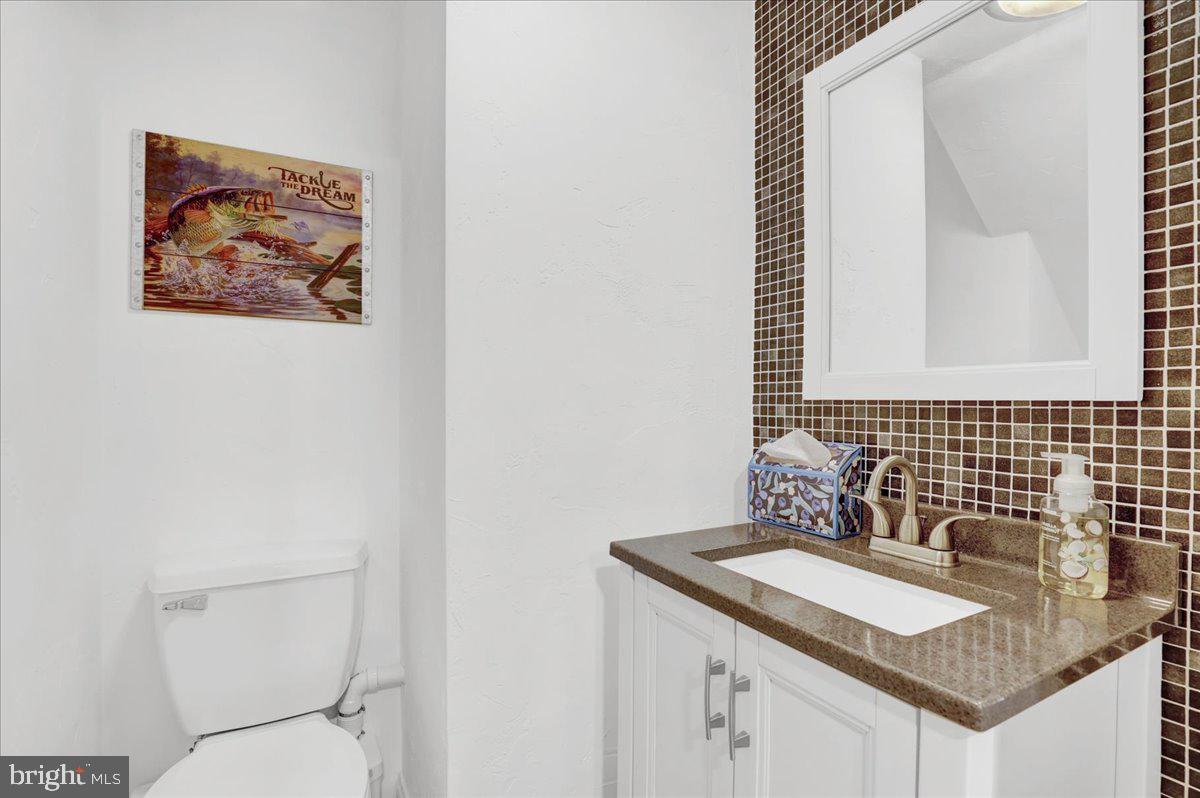 41 Michelle Way Hanover, PA 17331 - Photo 33 of 49 a bathroom with a granite countertop sink and a toilet