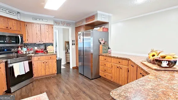 a kitchen with a window a sink and a refrigerator
