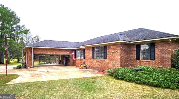 a view of a swimming pool and a yard