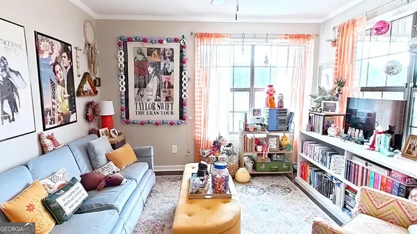 a living room with furniture and a flat screen tv