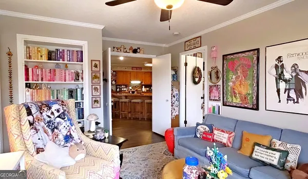 a kitchen that has a lot of cabinets in it and stainless steel appliances