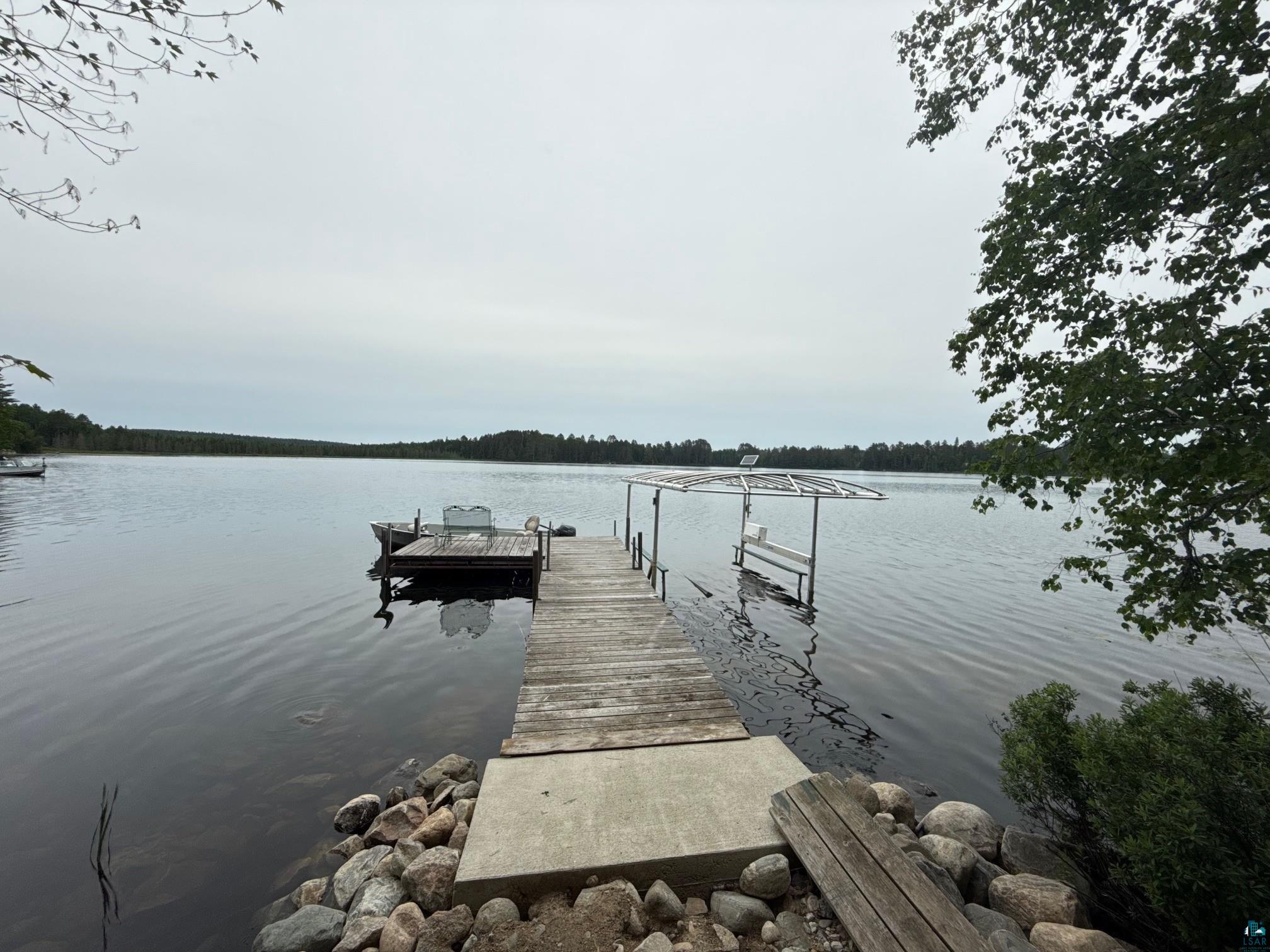 8141 Muskego Point Orr, MN 55771 - Photo 15 of 48 Back dock has additional sitting platform and bench with the boat lift station - solar powered with remote.