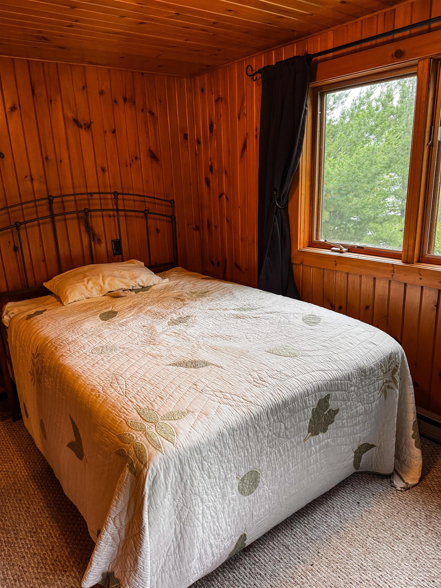 8141 Muskego Point Orr, MN 55771 - Photo 37 of 48 Bedroom with wood walls, wood ceiling, and carpet