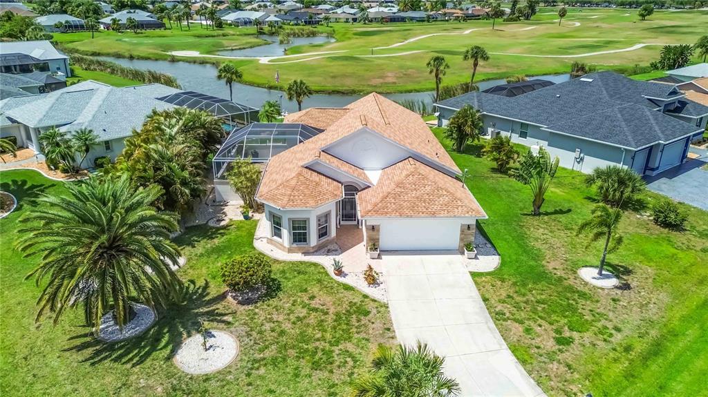 48 Bunker Road Rotonda West, FL 33947 - Photo 51 of 59 a view of a lake with a yard and plants