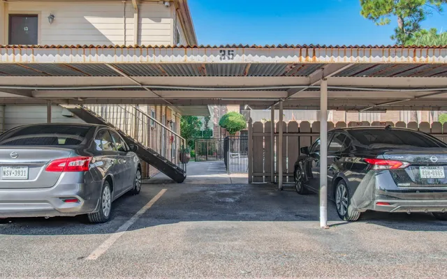 a view of parking garage with cars