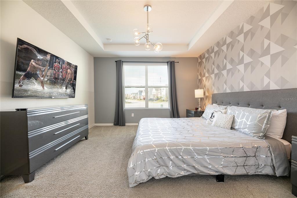 8900 Caroline Bay Court Kissimmee, FL 34747 - Photo 13 of 62 a bedroom with a bed and a window