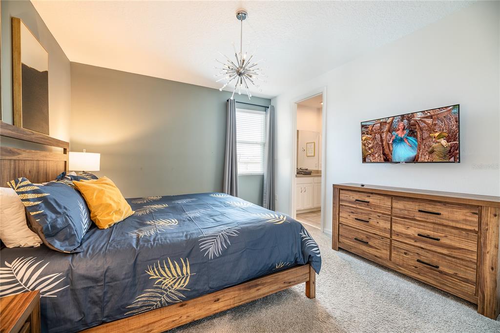 8900 Caroline Bay Court Kissimmee, FL 34747 - Photo 25 of 62 a bedroom with a bed and window