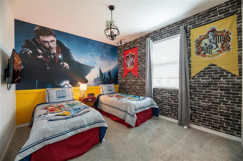 8900 Caroline Bay Court Kissimmee, FL 34747 - Photo 26 of 62 a bedroom with bed and a window