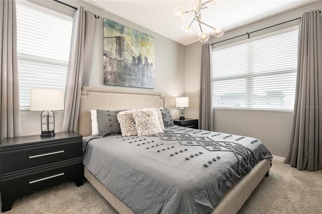 8900 Caroline Bay Court Kissimmee, FL 34747 - Photo 30 of 62 a bedroom with a bed and a window
