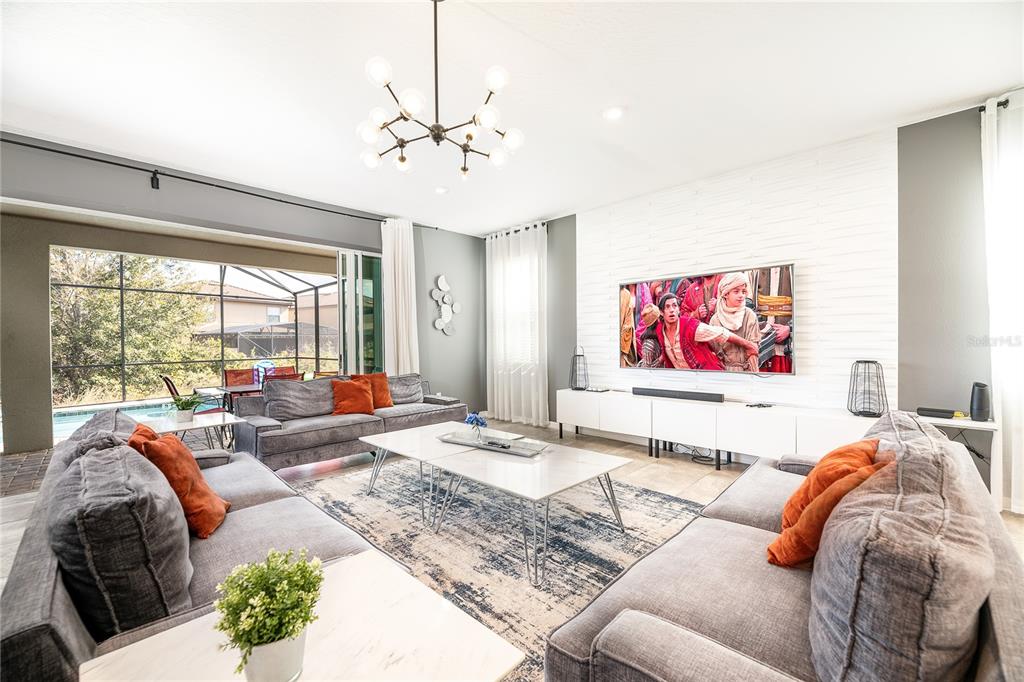 8900 Caroline Bay Court Kissimmee, FL 34747 - Photo 3 of 62 a living room with furniture and a large window