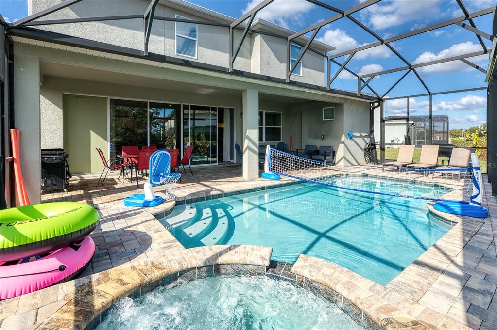 8900 Caroline Bay Court Kissimmee, FL 34747 - Photo 44 of 62 a view of a house with backyard outdoor seating area and furniture