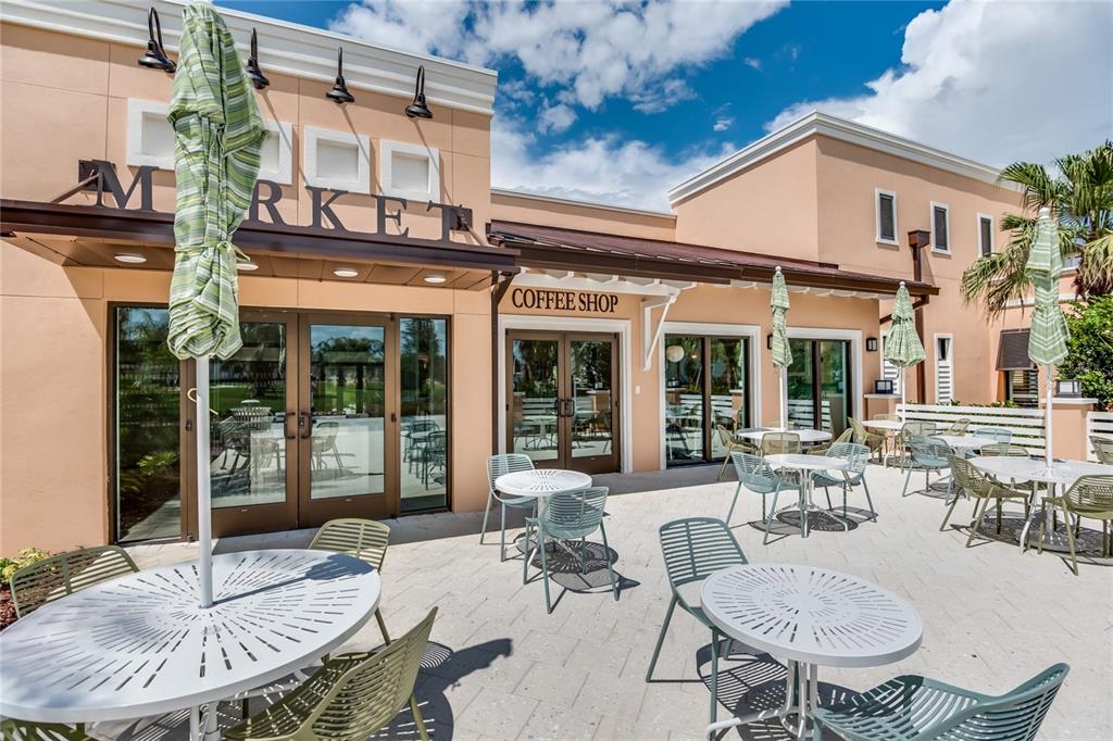 8900 Caroline Bay Court Kissimmee, FL 34747 - Photo 49 of 62 a view of a patio with table and chairs and potted plants
