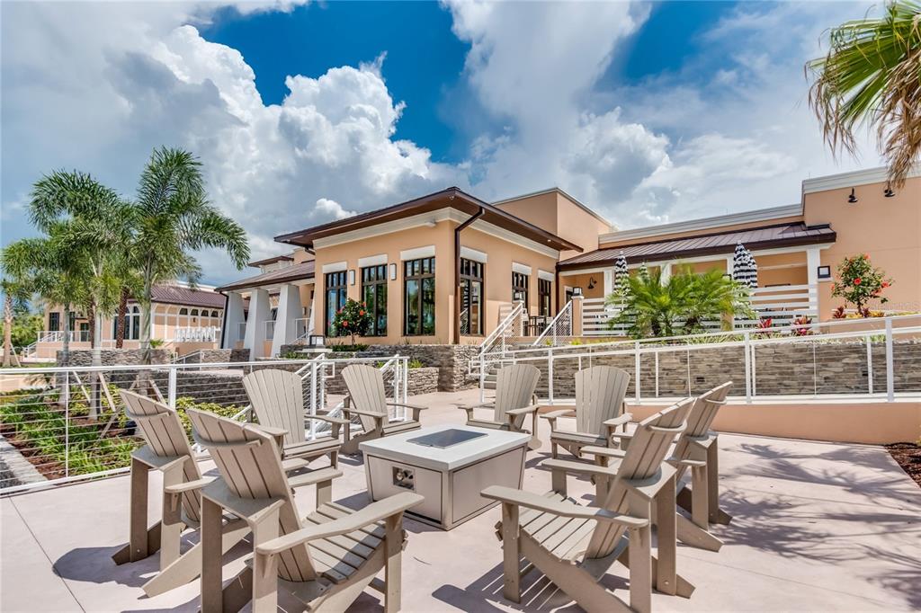 8900 Caroline Bay Court Kissimmee, FL 34747 - Photo 55 of 62 a view of a patio with table and chairs potted plants and floor to ceiling window