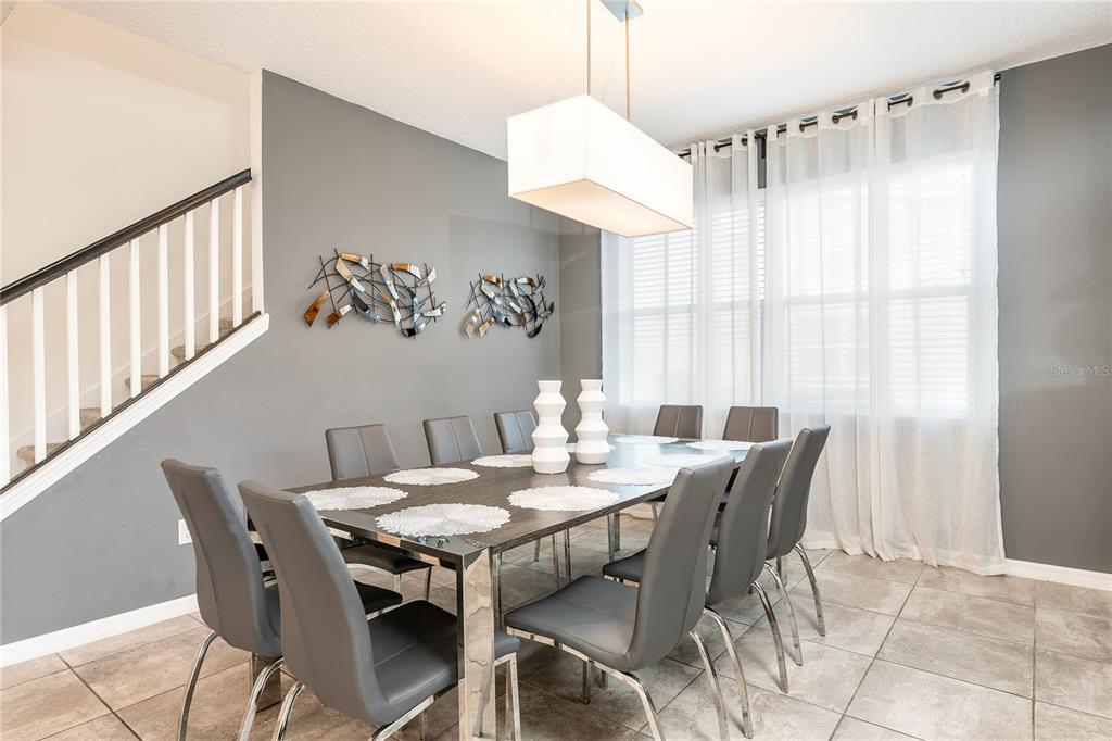 8900 Caroline Bay Court Kissimmee, FL 34747 - Photo 9 of 62 a view of a dining room with furniture window and outside view