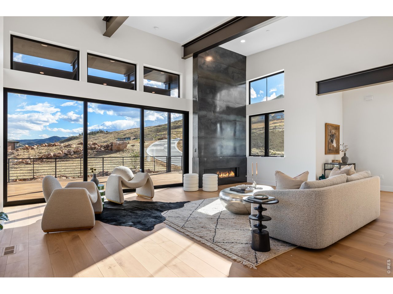 9578 Mountain Ridge Drive Boulder, CO 80302 - Photo 13 of 47 a living room with furniture and a floor to ceiling window