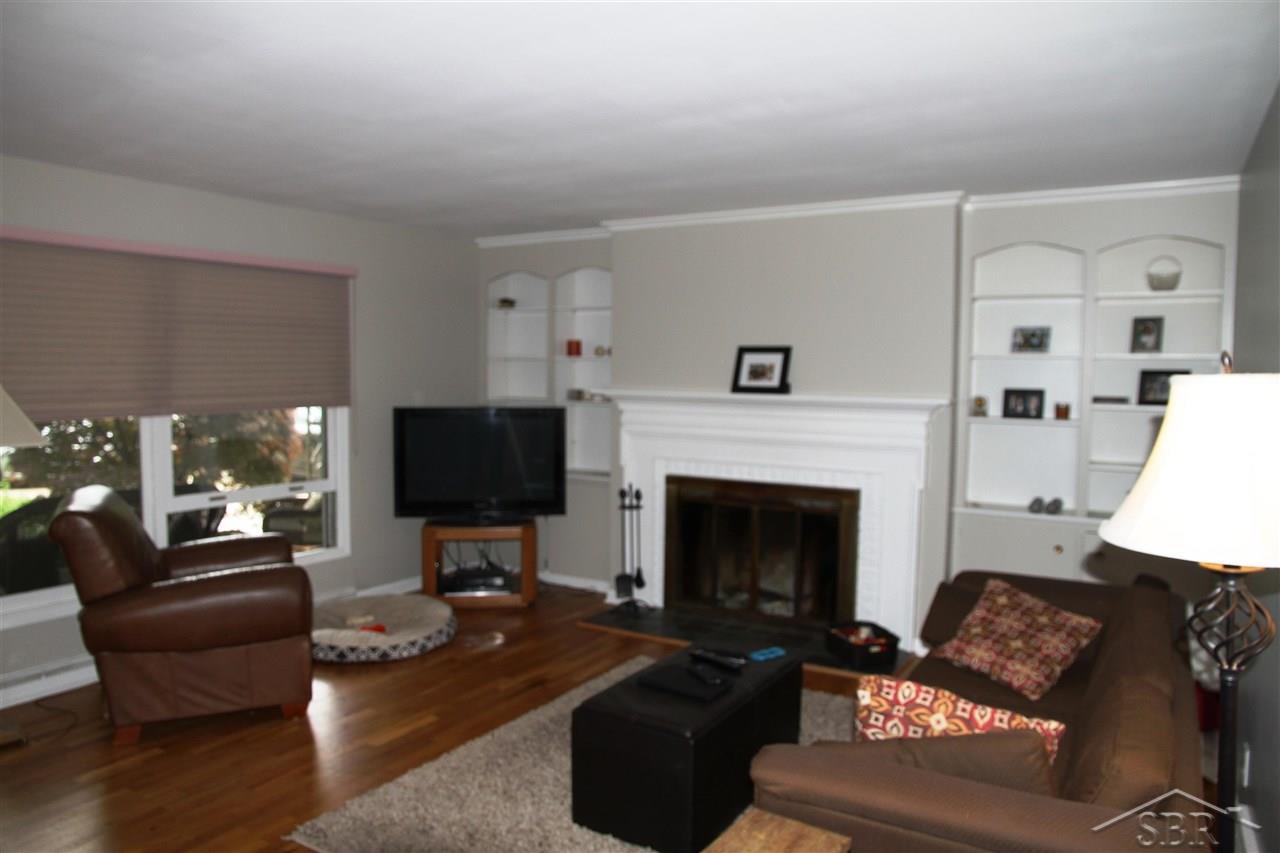 741 Somerset Road Saginaw, MI 48638 - Photo 2 of 26 Good Size Living Room With Hardwood Floors and Fireplace