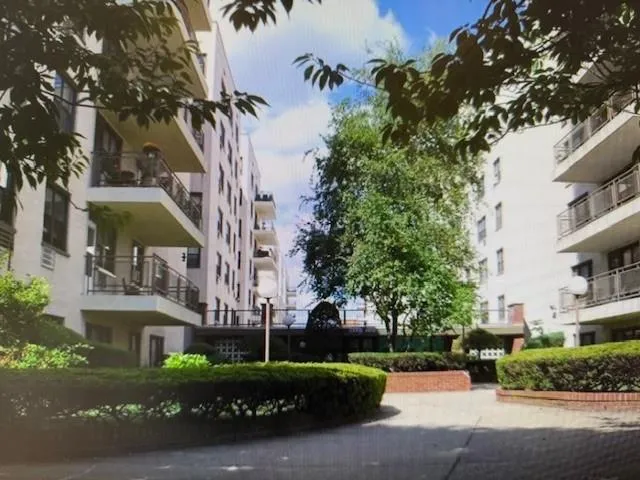 front view of a building with a garden