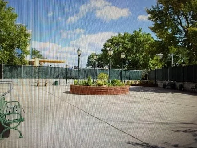 a view of a yard with swimming pool and furniture