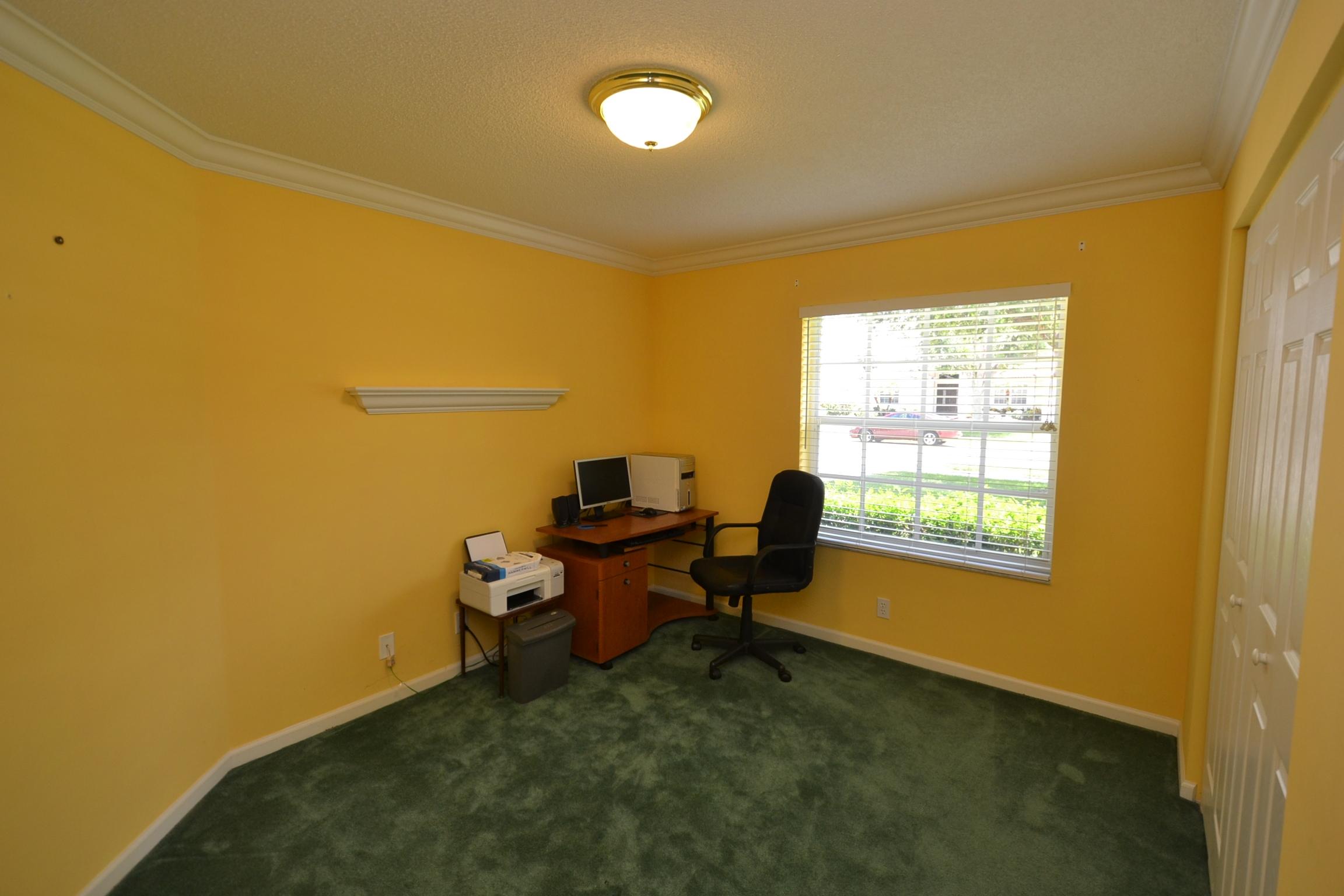 112 West Lee Road Delray Beach, FL 33445 - Photo 27 of 30 a view of a workspace with furniture and a window