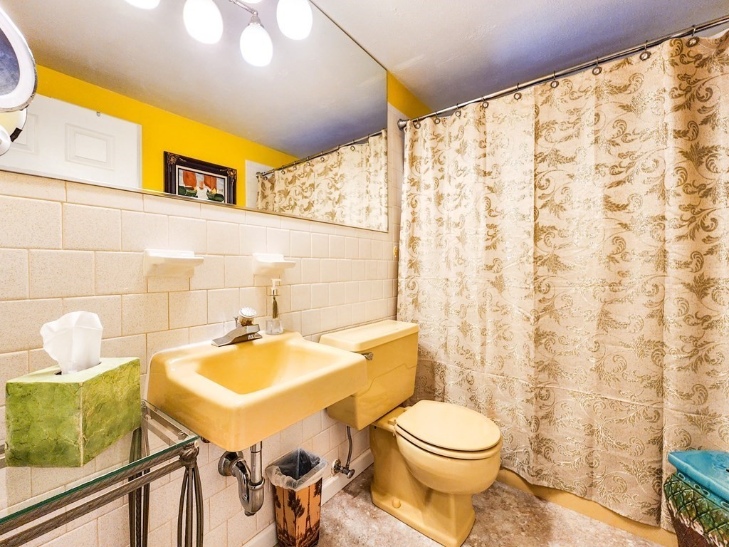 12 Peaceful Lane Wareham, MA 02538 - Photo 12 of 41 a bathroom with a sink a toilet and a mirror