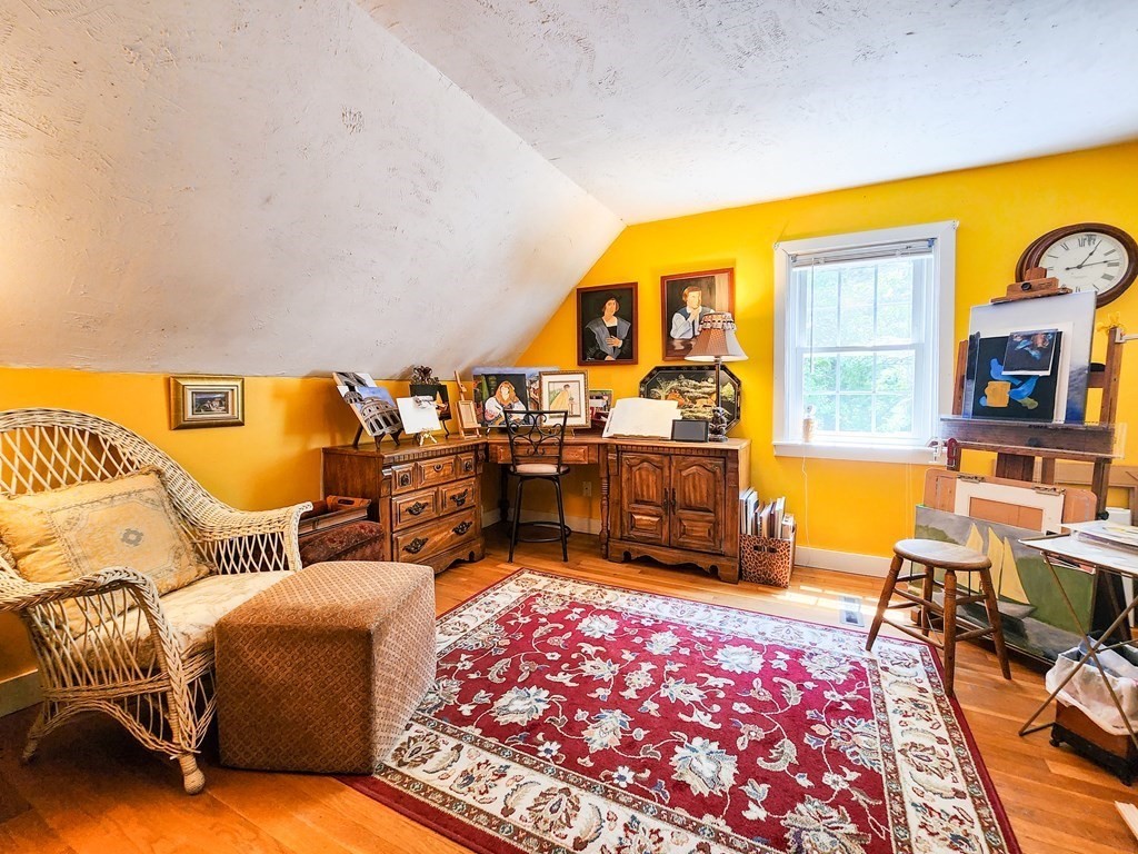 12 Peaceful Lane Wareham, MA 02538 - Photo 19 of 41 a living room with furniture a rug and a floor to ceiling window