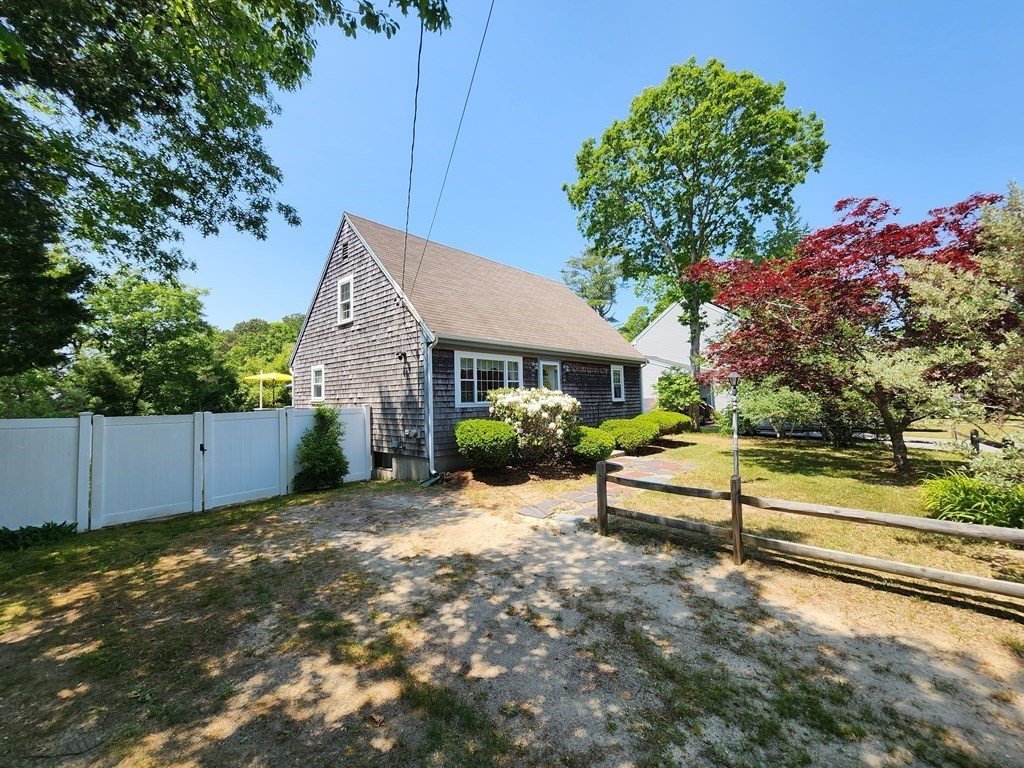 12 Peaceful Lane Wareham, MA 02538 - Photo 31 of 41 a view of a house with a yard and sitting area