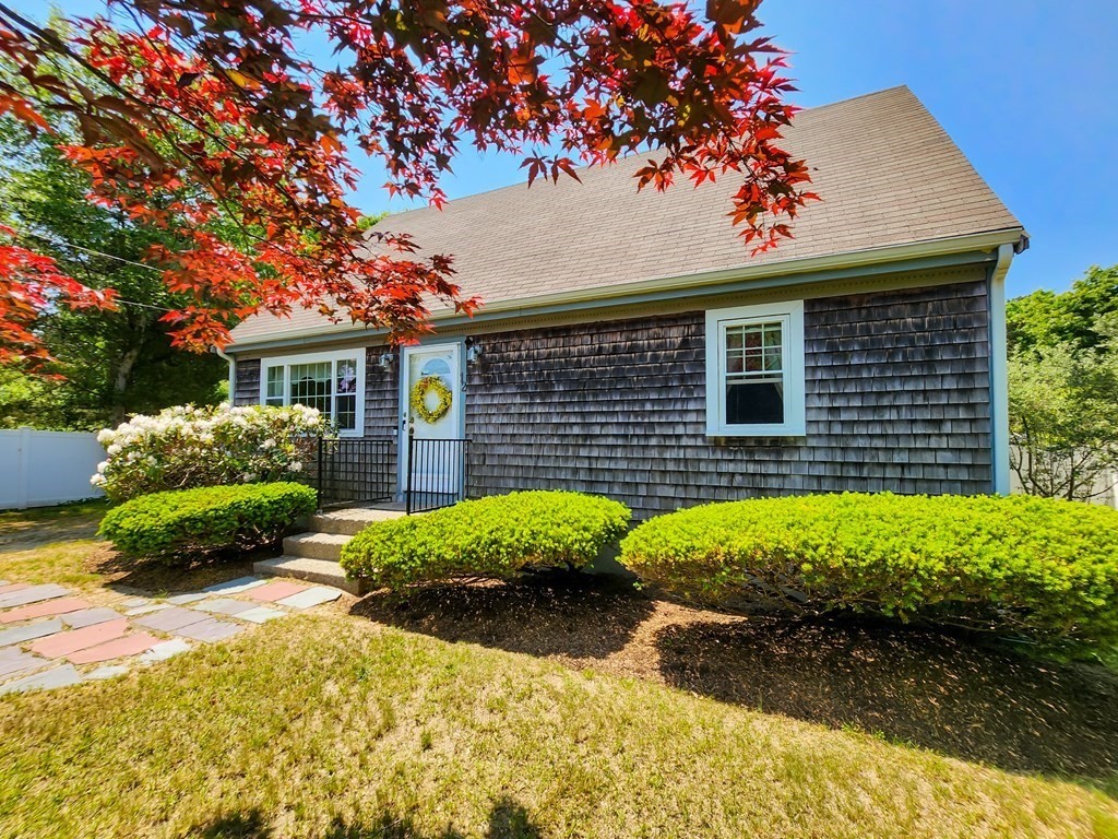 12 Peaceful Lane Wareham, MA 02538 - Photo 33 of 41 a front view of a house with garden