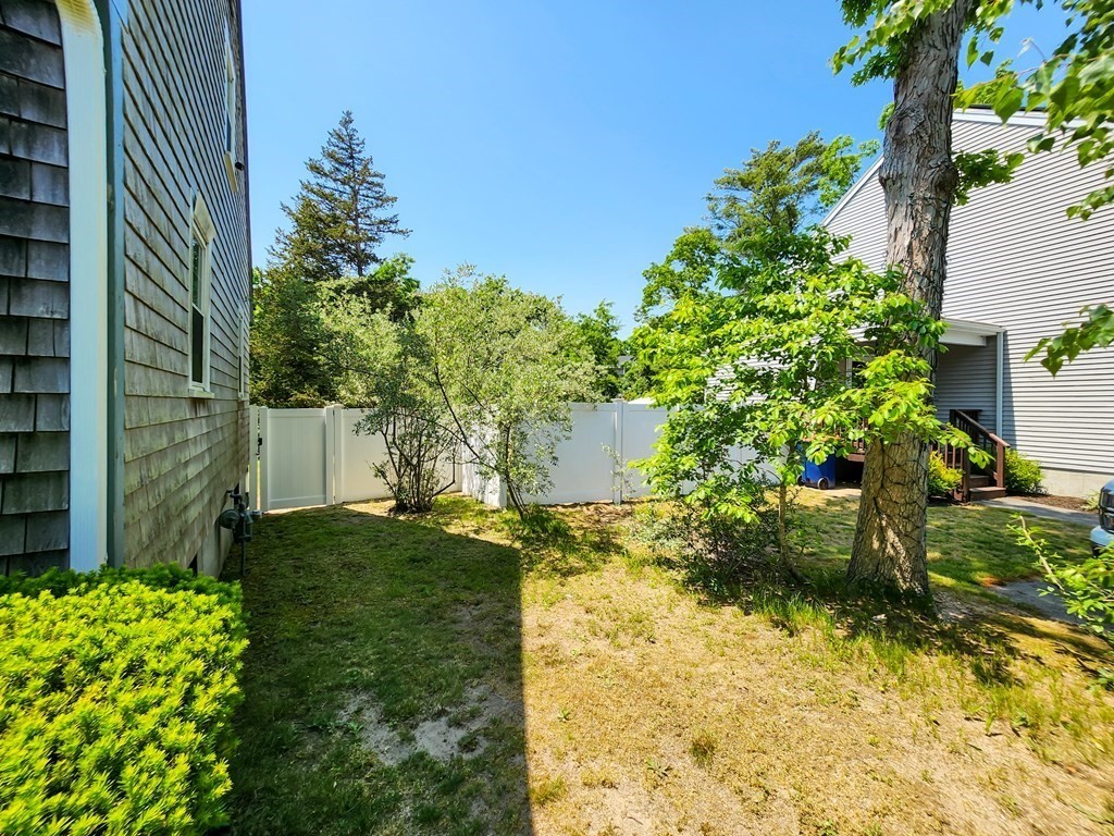 12 Peaceful Lane Wareham, MA 02538 - Photo 36 of 41 a view of a yard with plants and large trees