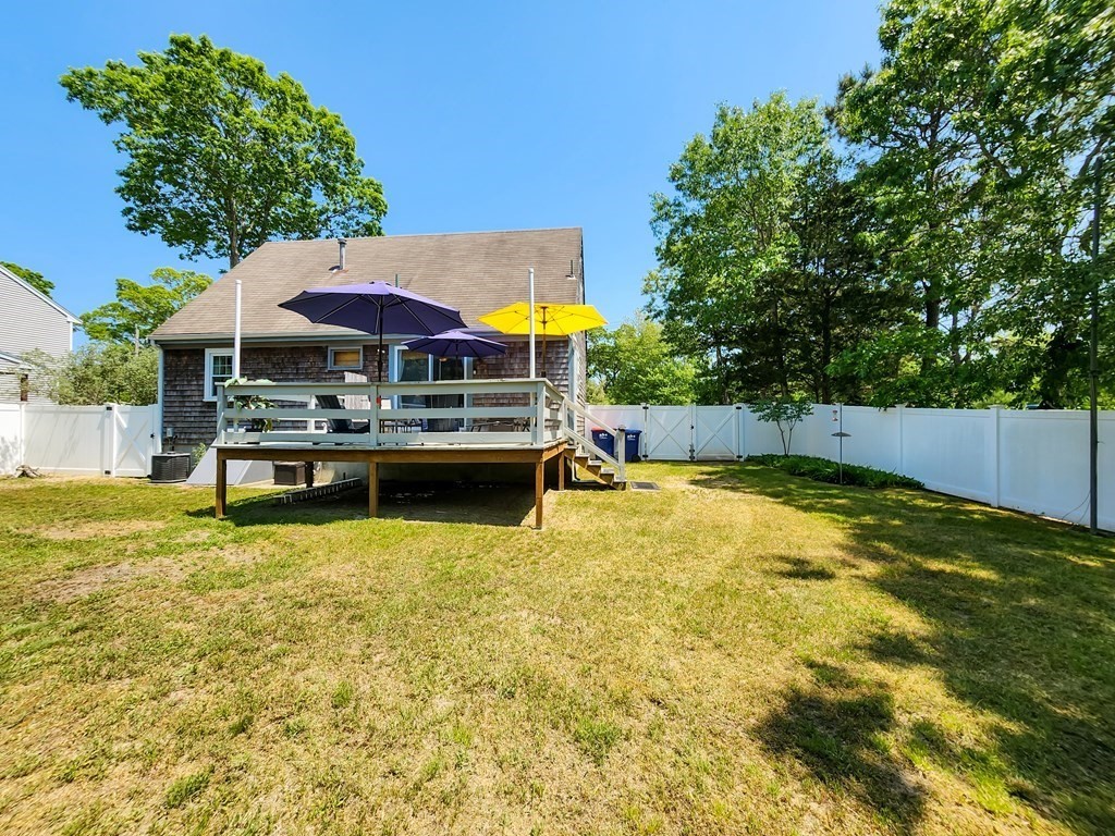12 Peaceful Lane Wareham, MA 02538 - Photo 38 of 41 a view of a swimming pool with lawn chairs under an umbrella