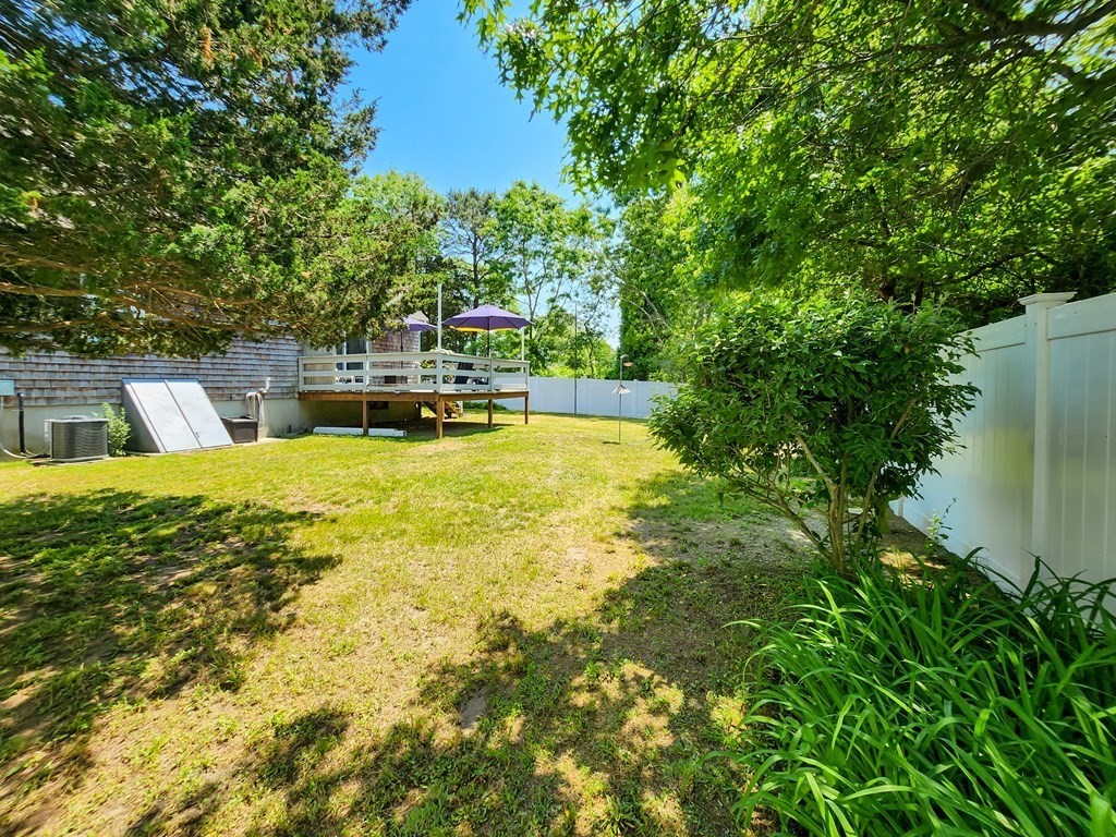 12 Peaceful Lane Wareham, MA 02538 - Photo 41 of 41 a view of a swimming pool with a lawn chairs and plants