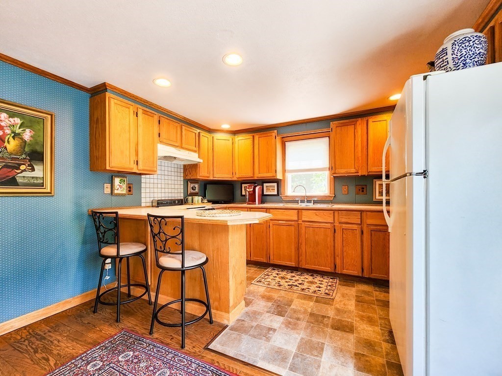 12 Peaceful Lane Wareham, MA 02538 - Photo 10 of 41 a kitchen with a sink cabinets and window