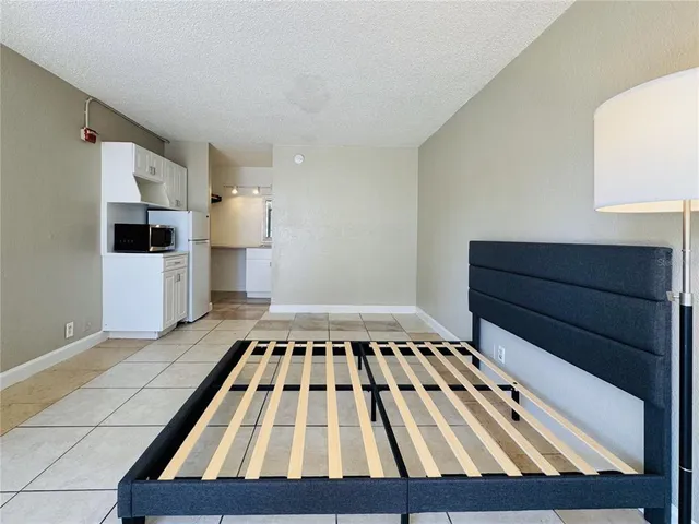 a kitchen with wooden floor and a sink