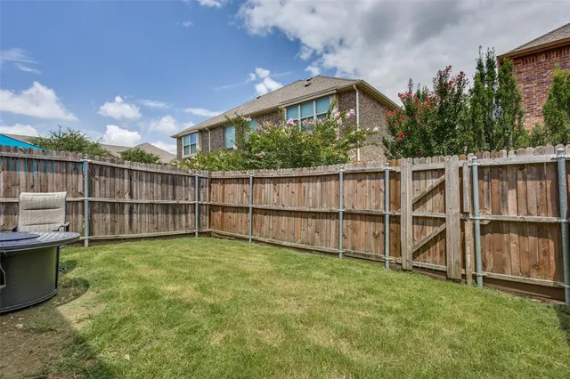 a view of a backyard with a small cabin