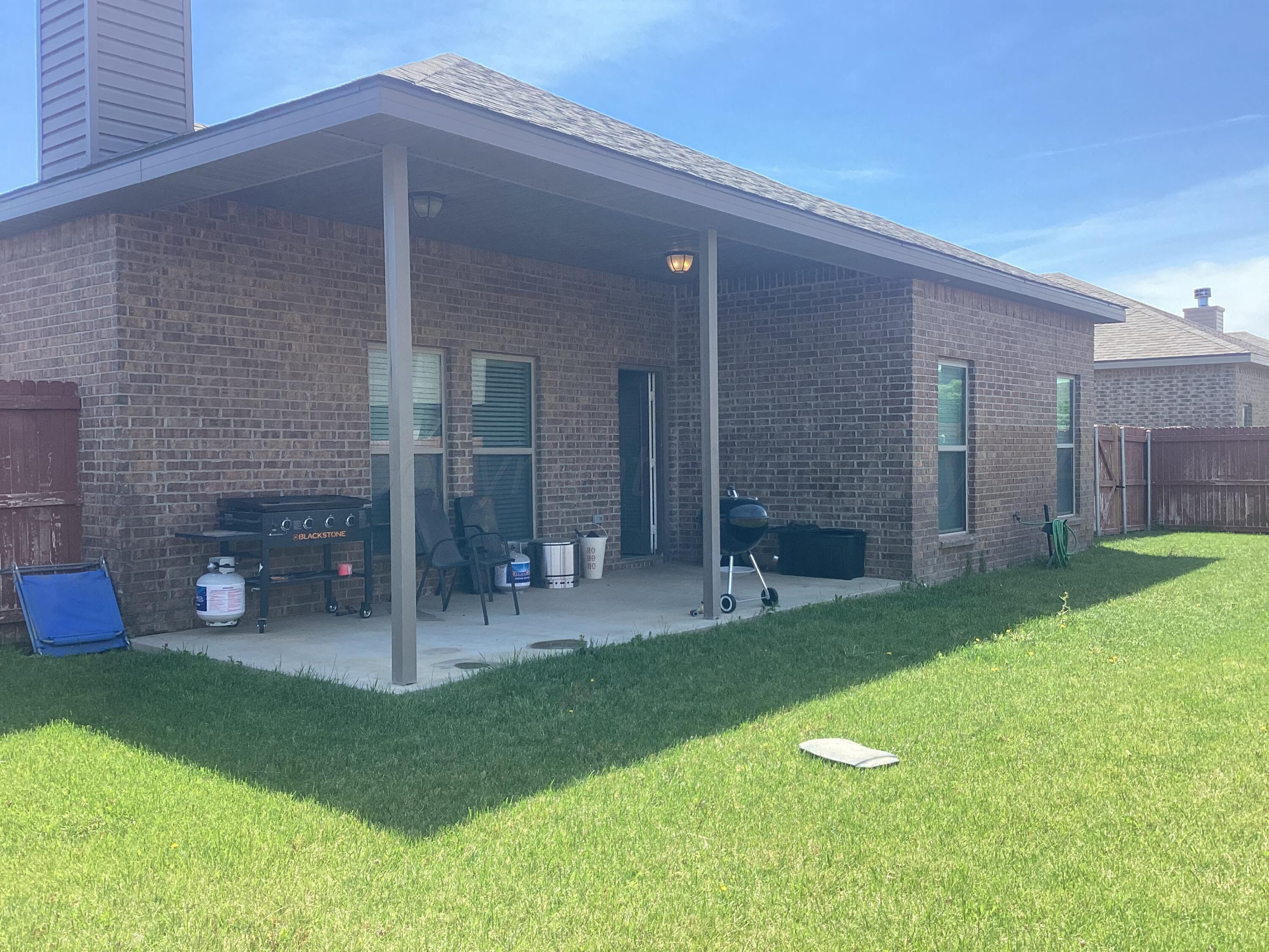7206 Sinclair Street Amarillo, TX 79119 - Photo 21 of 21 a view of a porch with a backyard
