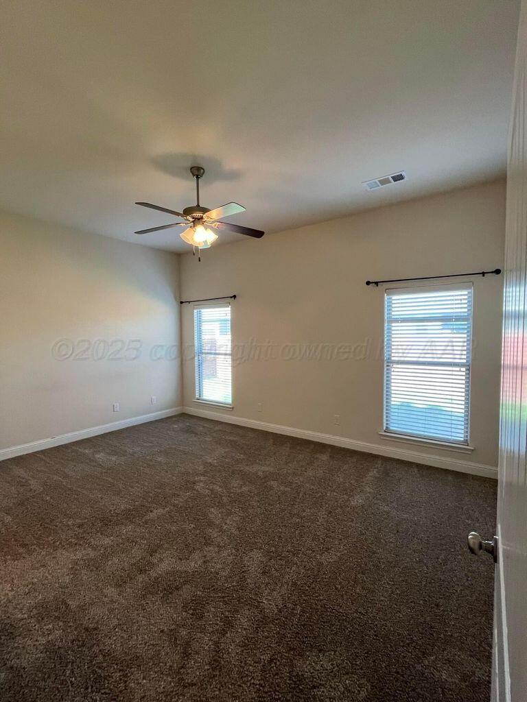 7206 Sinclair Street Amarillo, TX 79119 - Photo 6 of 21 an empty room with a window