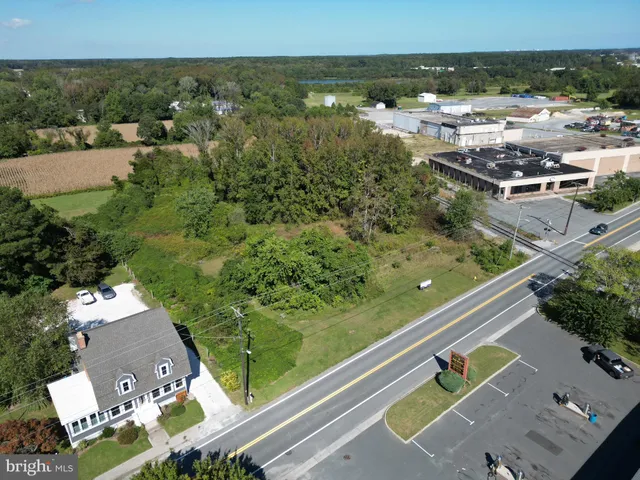 an aerial view of swimming pool with a yard