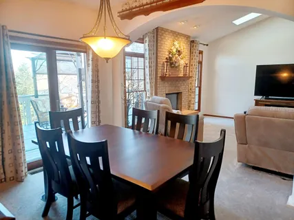 a view of a dining room with furniture window and outside view