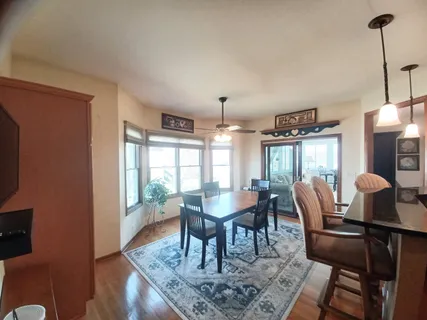 a dining room with furniture and window