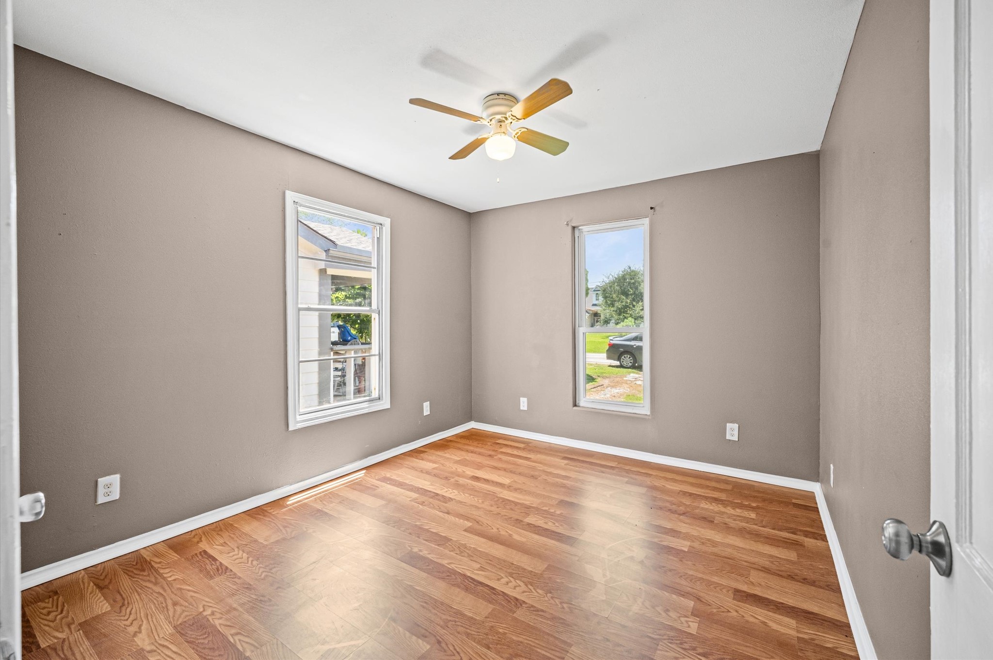 10621 Lane Street Houston, TX 77029 - Photo 15 of 29 a view of an empty room with wooden floor and a window
