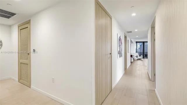 a view of a kitchen with a sink and large window